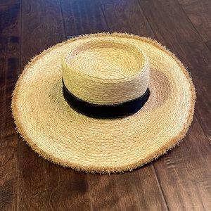 Wide brim straw hat with black band